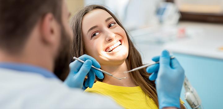 person getting teeth examined